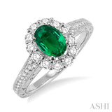 7x5mm Oval Cut Emerald and 1/2 Ctw Round Cut Diamond Ring in 14K White Gold