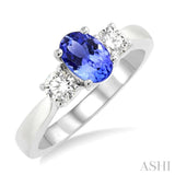 7X5mm Oval Shape Tanzanite and 1/2 Ctw Round Cut Diamond Ring in 14K White Gold